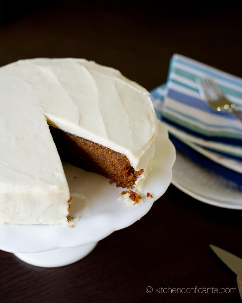 A one layer sweet potato cake fully frosted with cream cheese frosting on the top and sides.