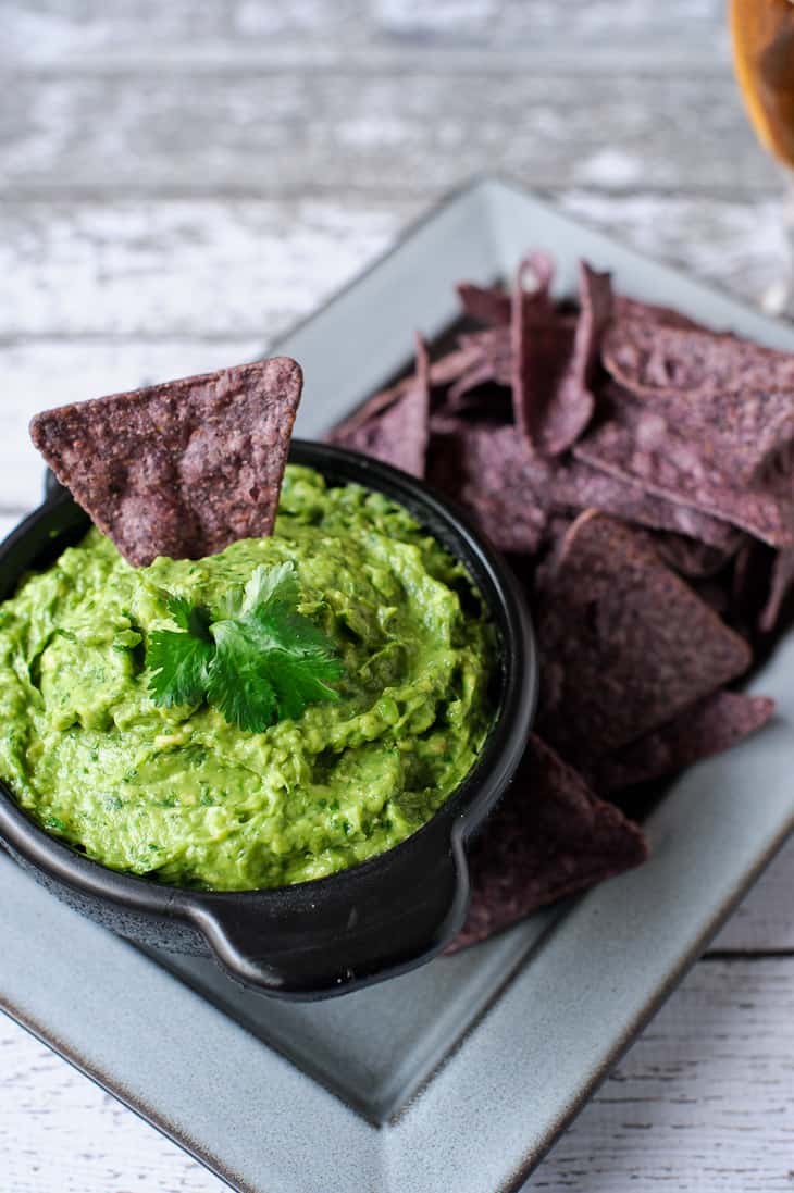 You won't be able to resist double dipping into this guacamole! Try this simple and flavor-packed recipe!