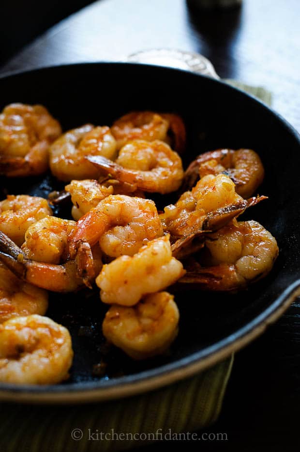 A dish full of cooked spicy shrimp.