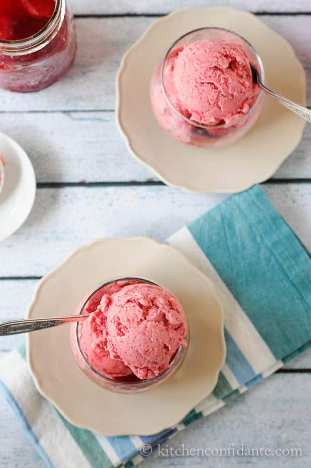 Glasses filled with scoops of pink homemade Strawberry Frozen Yogurt.