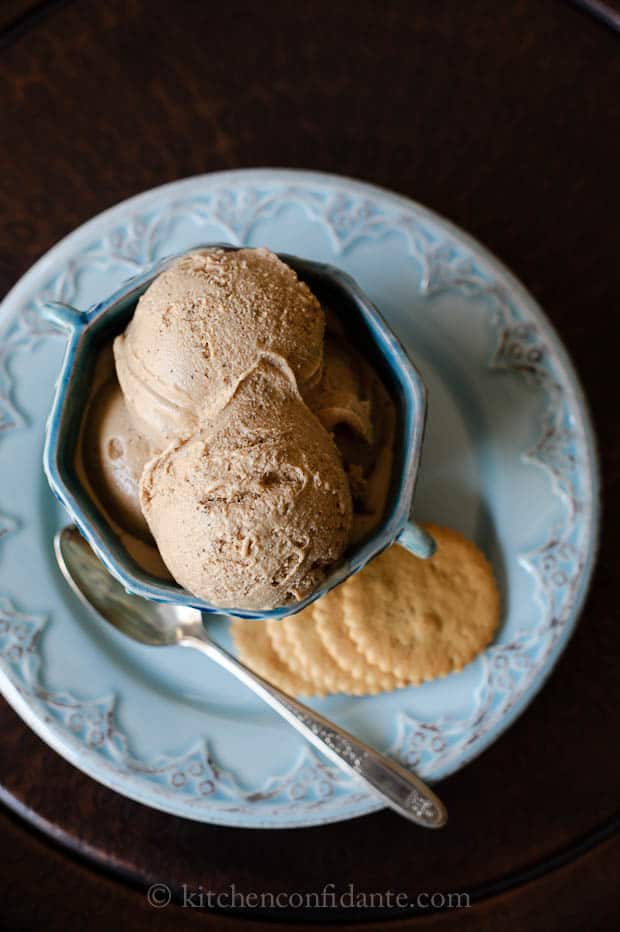 A bowl of icecream with cookies.