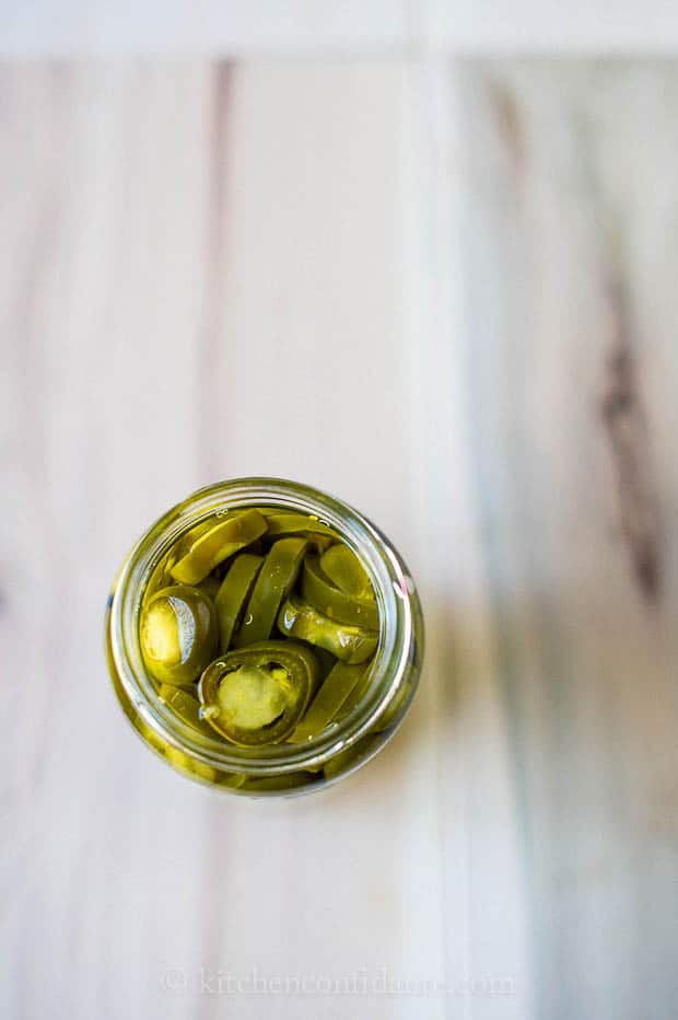 A jar of pickled jalepenos.