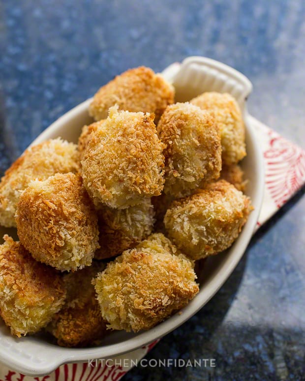 A white oval dish full of fresh Shrimp and Potato Croquettes
