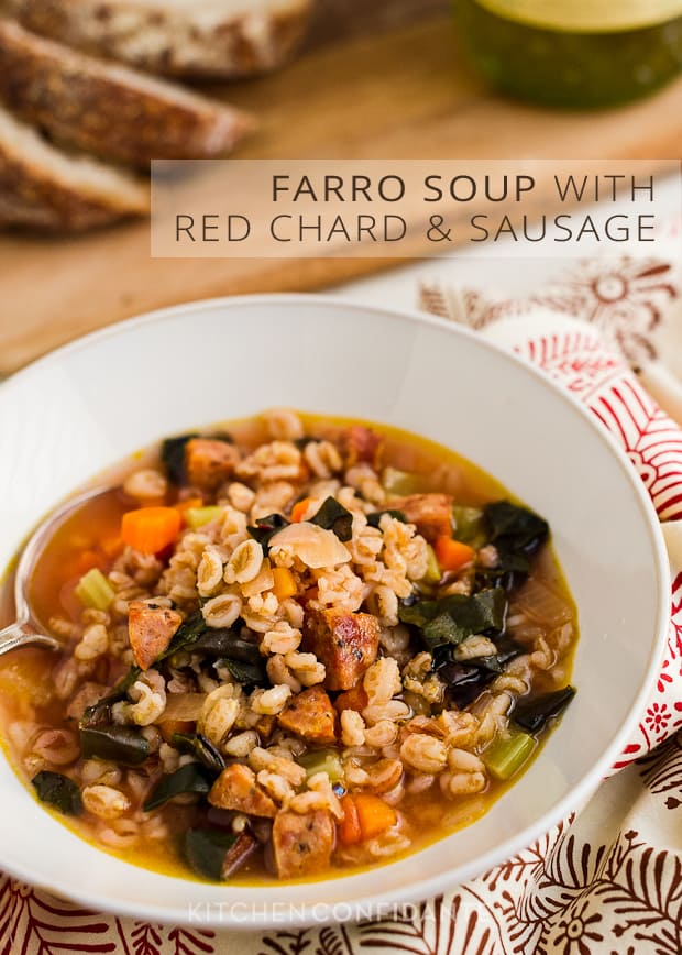 A white bowl filled with farro soup with the words, "Farro Soup with Red Chard and Sausage".