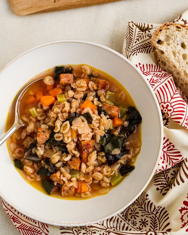 A bowl of Farro Soup with Red Chard and Sausage.