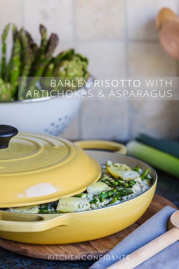 Barley Risotto with Artichokes and Asparagus in a yellow Le Creuset Braising pan.