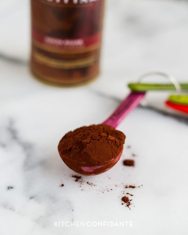 Measuring a tablespoon of cocoa powder.