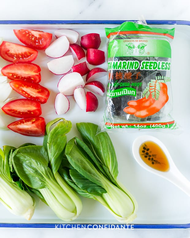 Sliced tomatoes and radishes, baby bok choy and tamarind paste.