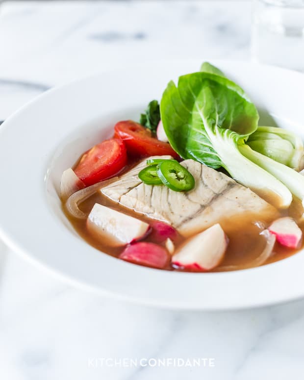 Barramundi Fish with Baby Bok Choy, Radishes and Sliced Tomatoes in Tamarind Broth (Sinigang na Isda).