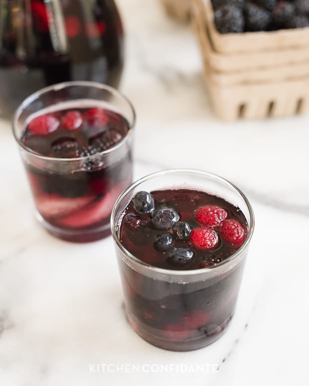 Two glasses of summer berry-filled sangria.