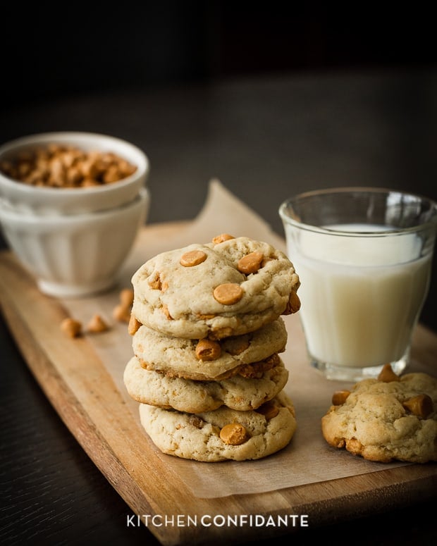 A stack of Butterscotch Chip Cookies and a glass of milk.