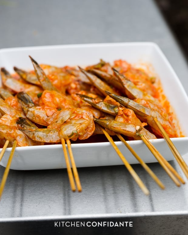 Marinated shrimp on skewers ready to grill.