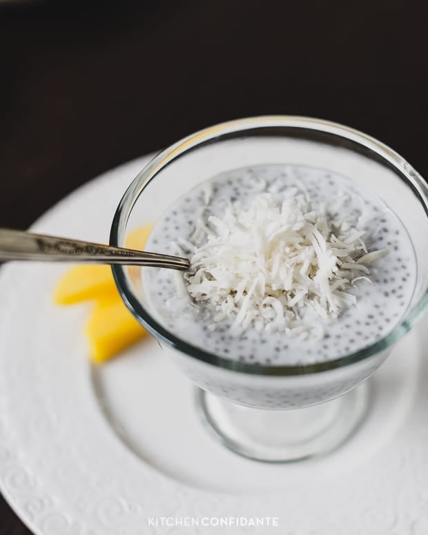 Chia pudding served in a glass and garnished with grated coconut.