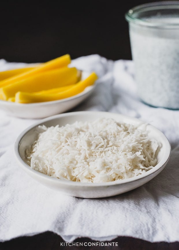 A bowl filled with grated coconut.