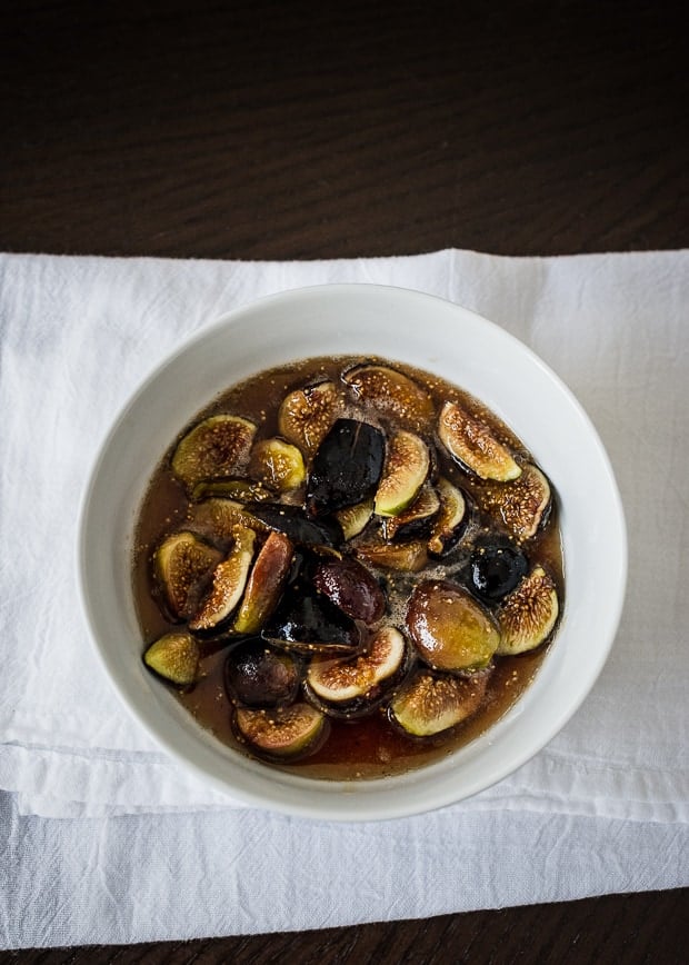 Sliced figs in a bowl of honey.