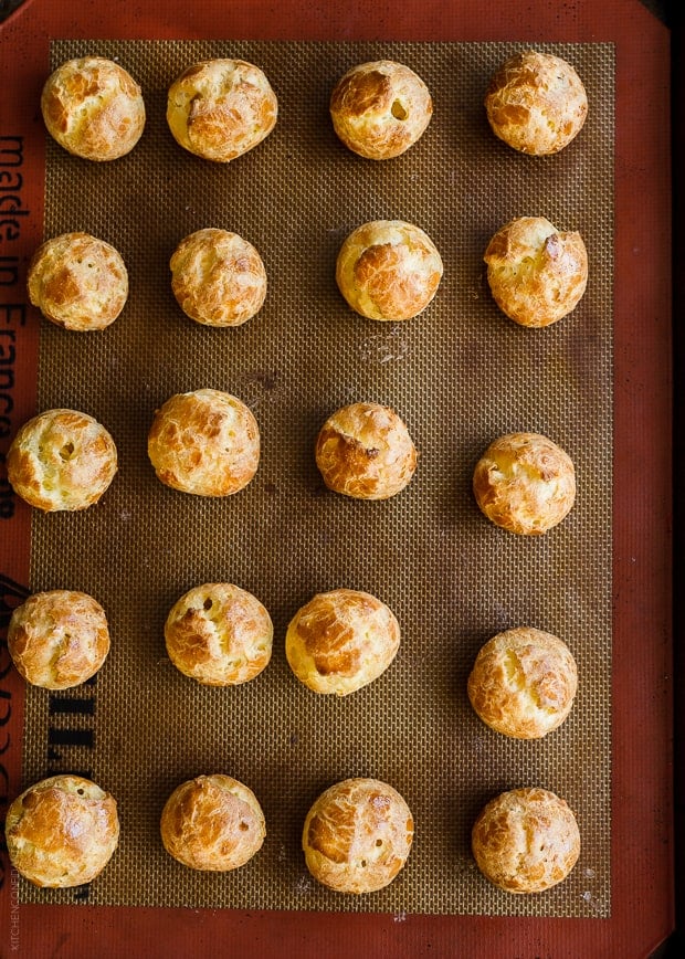 Homemade Cheese Puffs on a baking sheet.