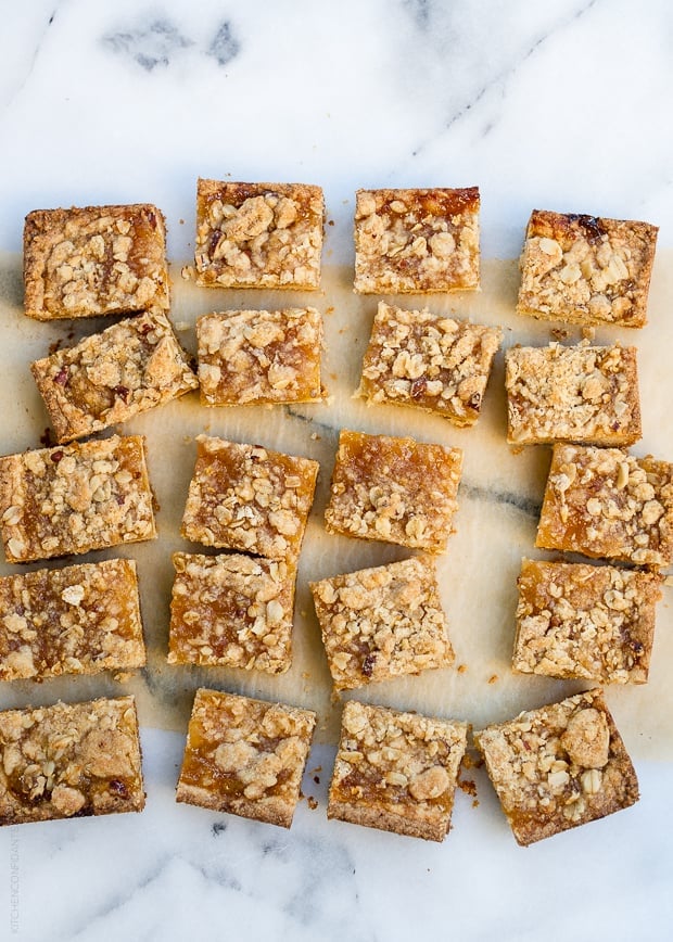 Meyer Lemon Bars cut and arranged on a marble surface. 