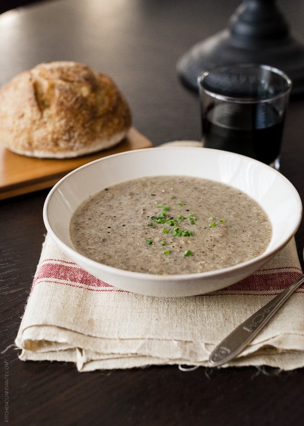 A white bowl filled with Roasted Mushroom and Cauliflower Soup.