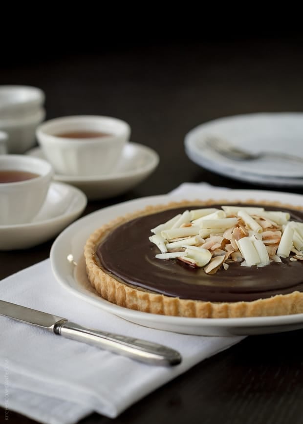 White chocolate curls and toasted coconut topping a Coconut Tart.