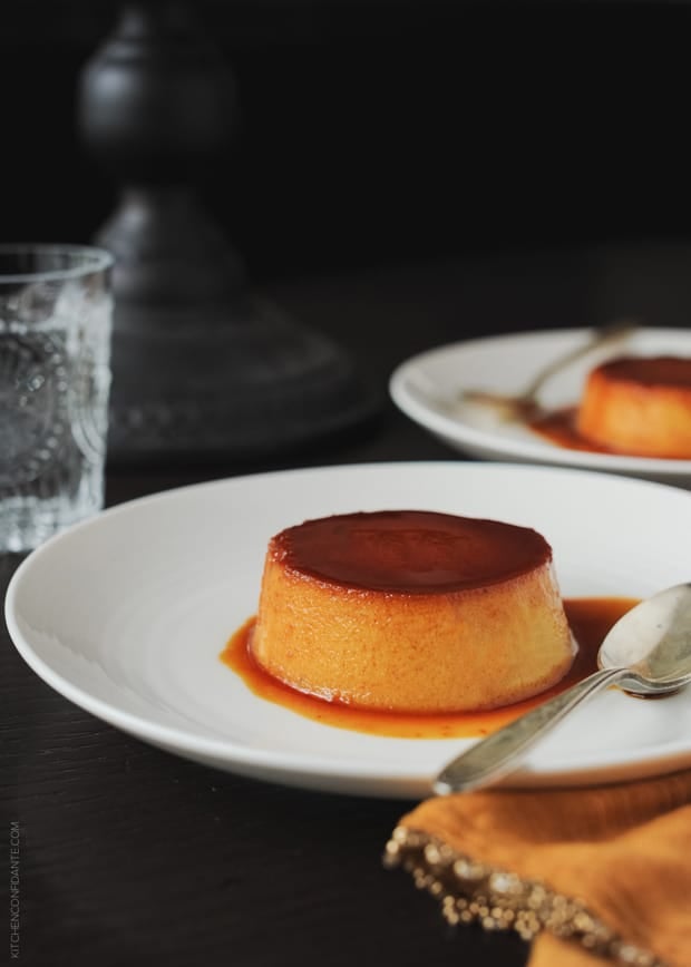 Individual Pumpkin Leche Flan with caramel served on a white plate.