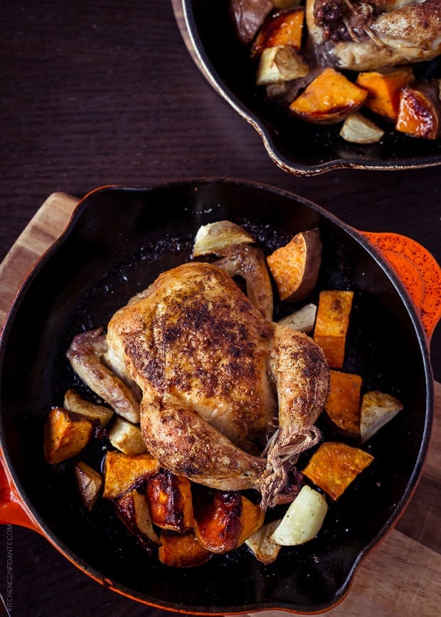 A Spice Roasted Cornish Hen and Sweet Potatoes in a skillet.