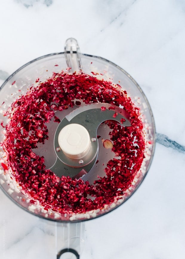Chopping cranberries in a food processor.