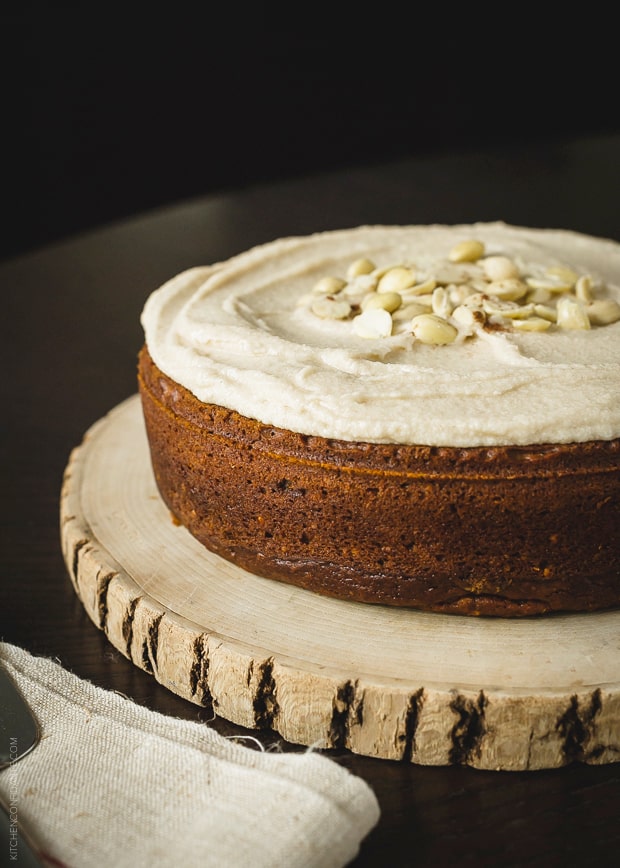A round Pumpkin Marcona Almond Cake with a layer of mascarpone frosting.