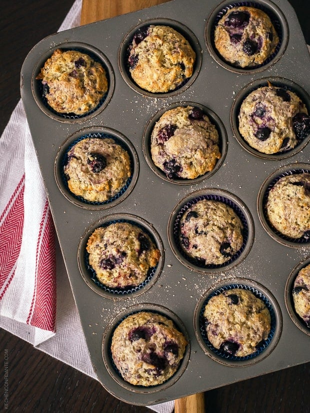 A muffin tin filled with Berry Flaxseed Muffins.