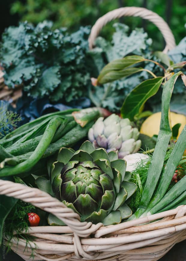 A basket full of freshly picked vegetables.