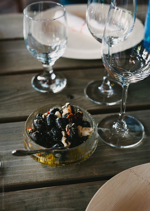 Image of the cocktail appetizer featuring black olives.