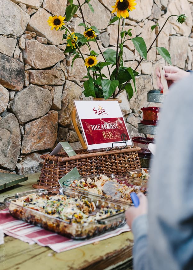 A photo of a breakfast bar serving savory dishes.