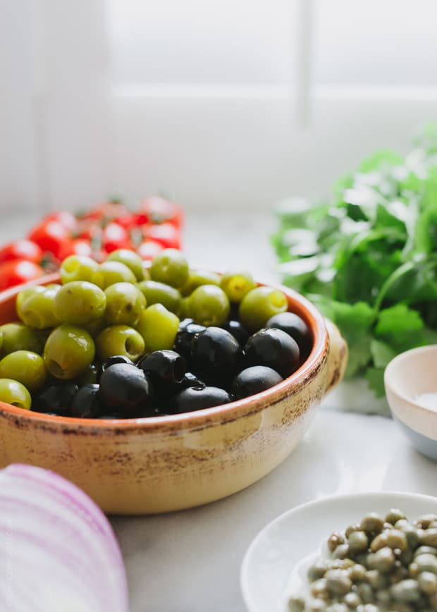 A bowl of green and black olives used in making Tomato Olive Salsa.