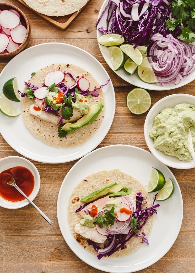 Fish Tacos with Avocado-Cilantro Sauce | www.kitchenconfidante.com