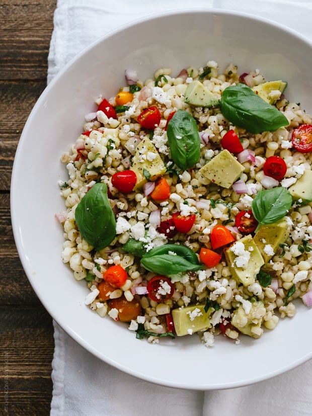 Summer Corn and Barley Salad in a white serving bowl.