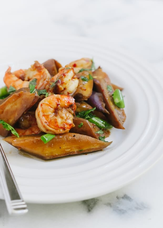 Sambal Glazed Eggplant and Shrimp on a white plate.