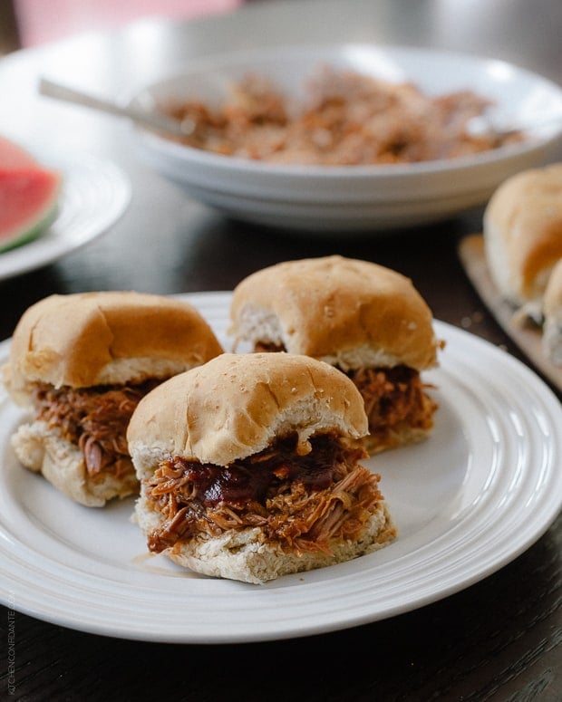 Slow Cooker Pulled Pork Sandwiches on a white plate.