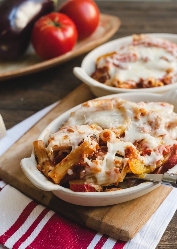 Baked Ziti with Roasted Eggplant and Peppers in a white baking dish.