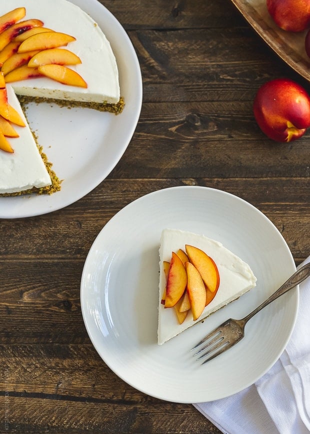 A No-Bake Goat Cheese Cheesecake with a slice removed and plated.