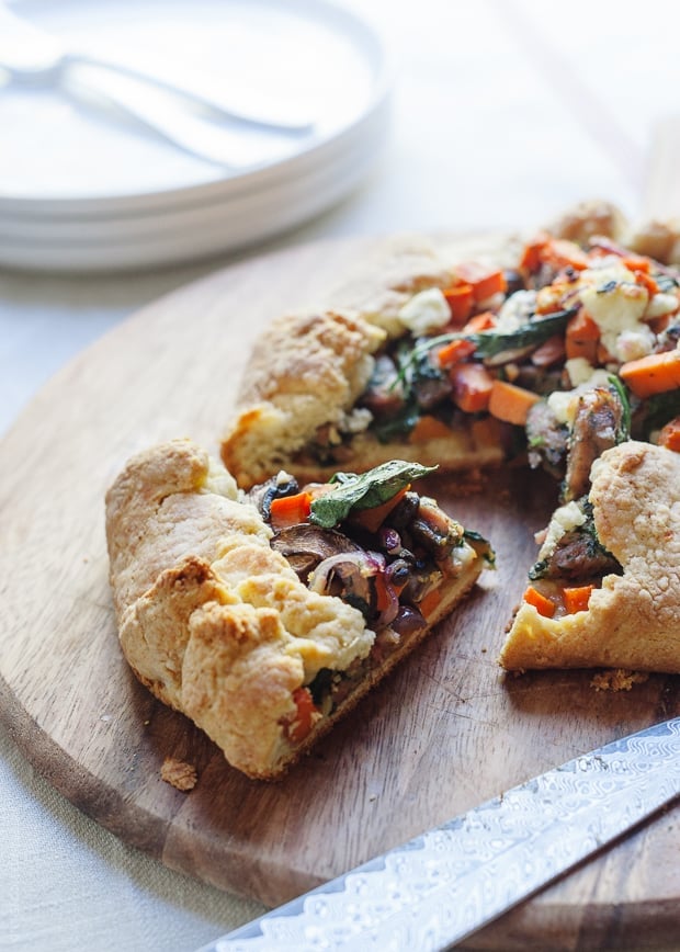 A Savory Chicken Sausage and Vegetable Galette with a slice removed.