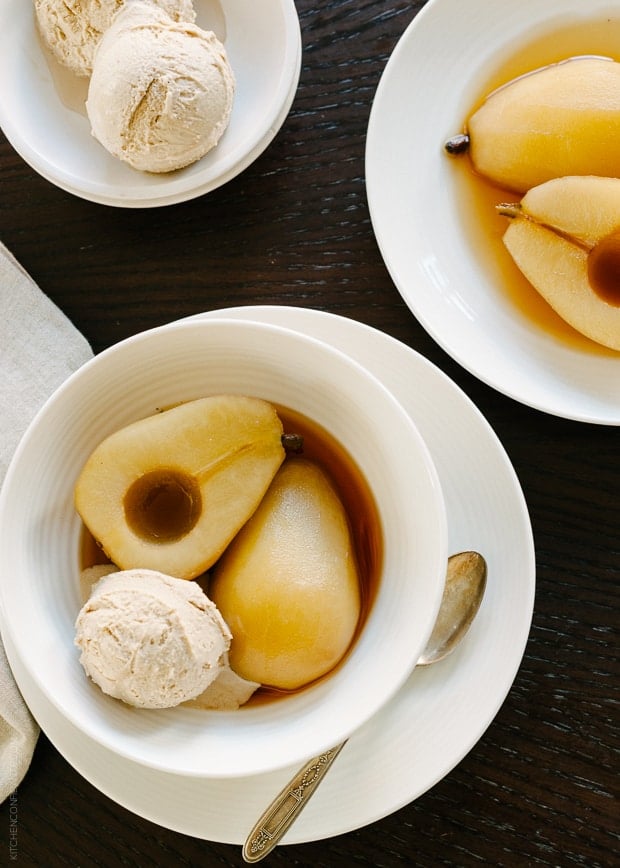 Tea Poached Pears with Earl Grey Ice Cream in white bowls.