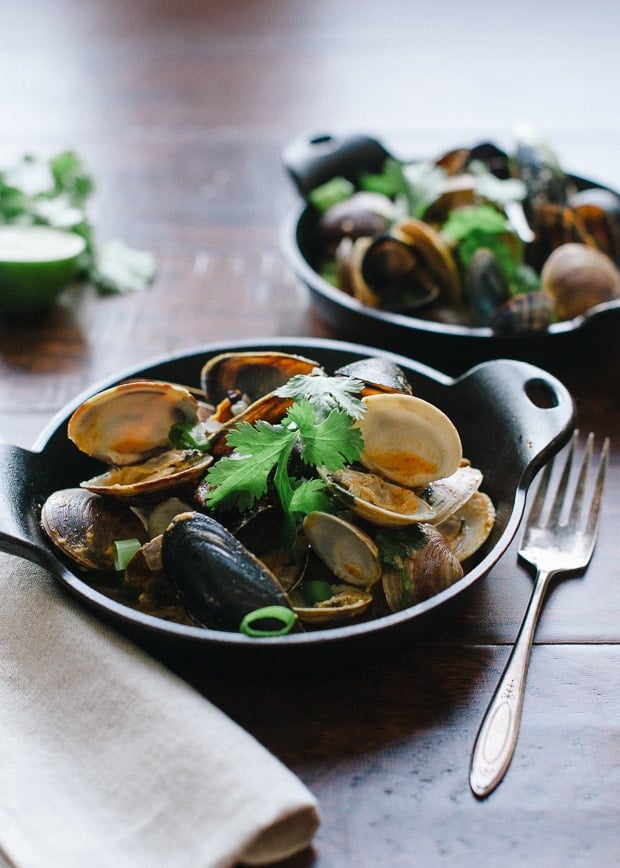 Steamed Clams and Mussels in Coconut Curry Broth | www.kitchenconfidante.com | Clams steam in minutes, making this a perfect appetizer or meal.