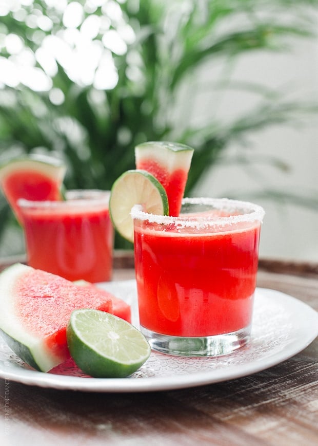 Watermelon Lime Margaritas garnished with slices of lime and watermelon.