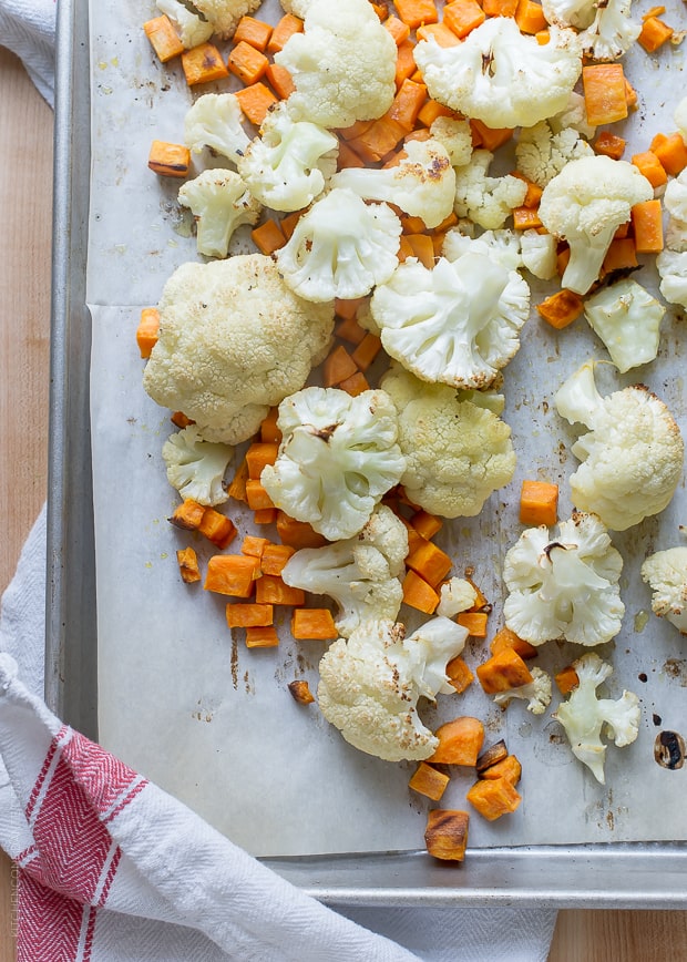 Roasted Cauliflower and Sweet Potatoes on a sheet pan.