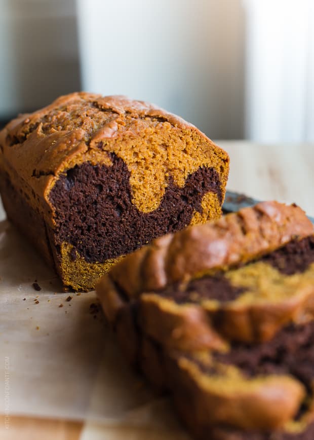 A loaf of Chocolate Marble Pumpkin Bread sliced and ready to eat.