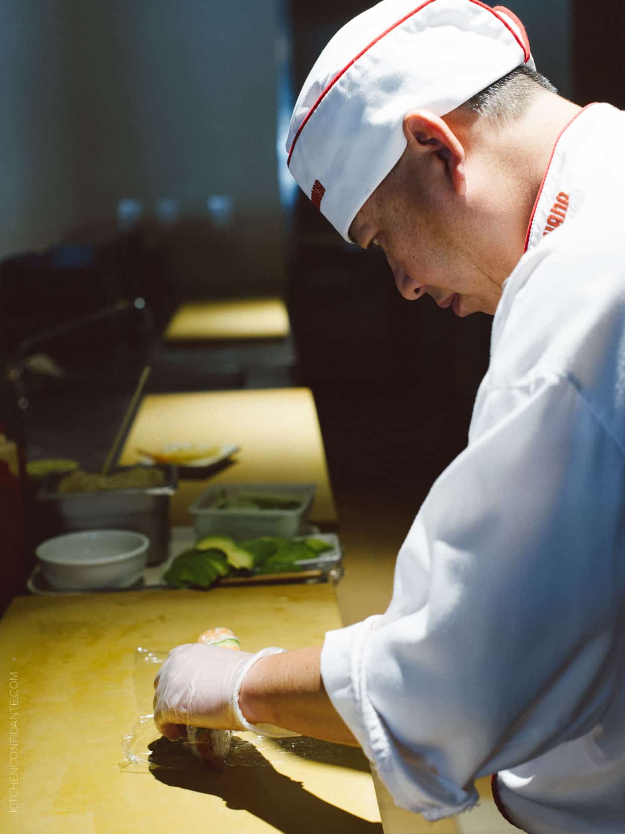 Chefs work their magic to make beautiful sushi.