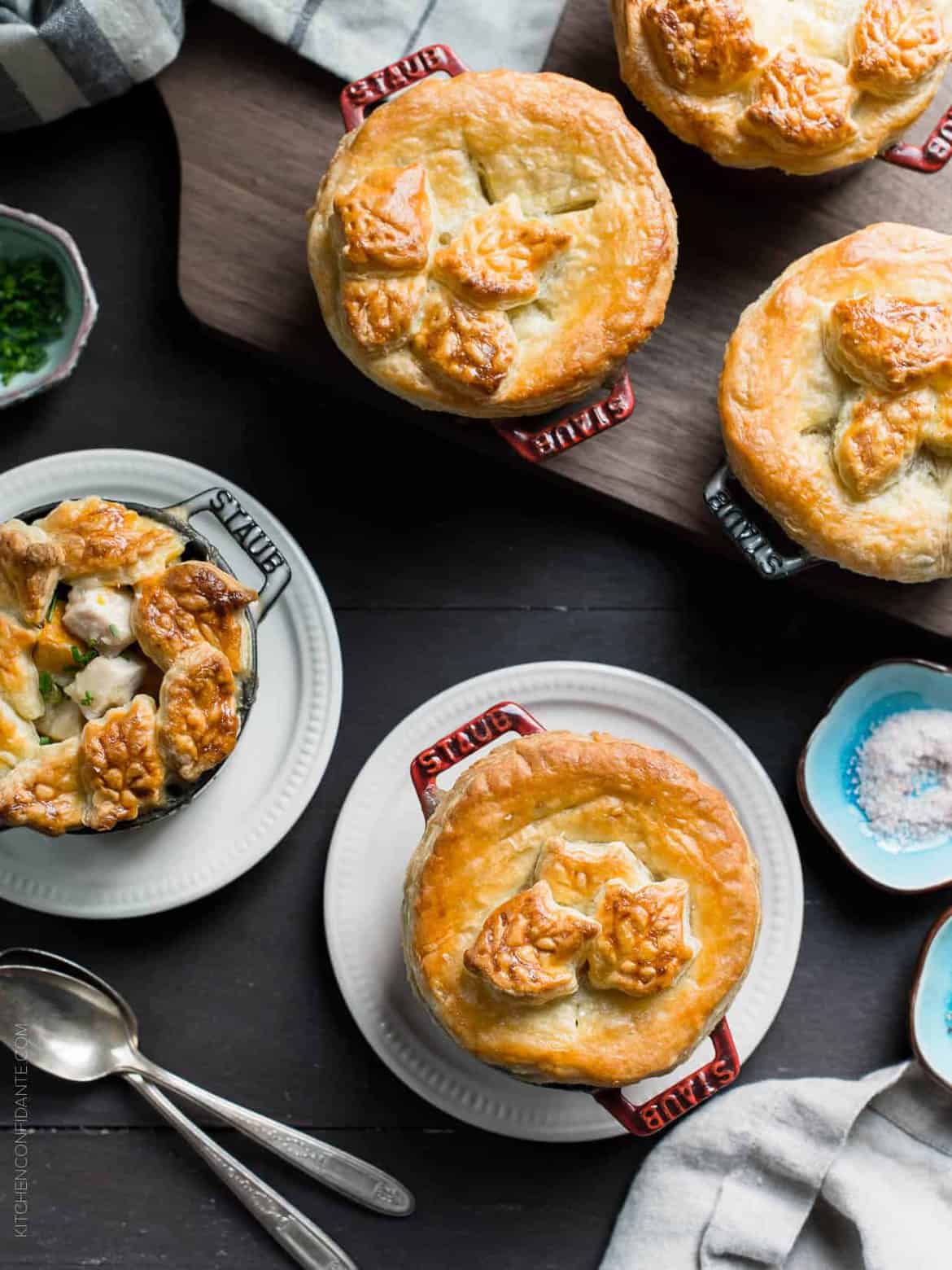 Turkey Pumpkin Pot Pies in single serving ramekins topped with golden-brown puff pastry.