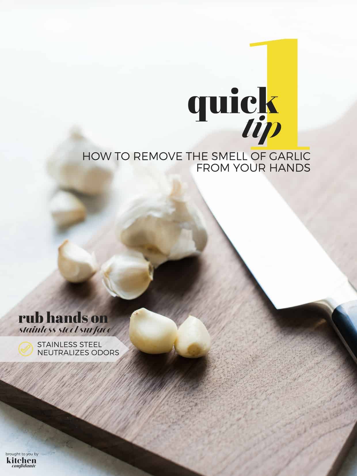 Garlic cloves and a knife on a wooden cutting board. 