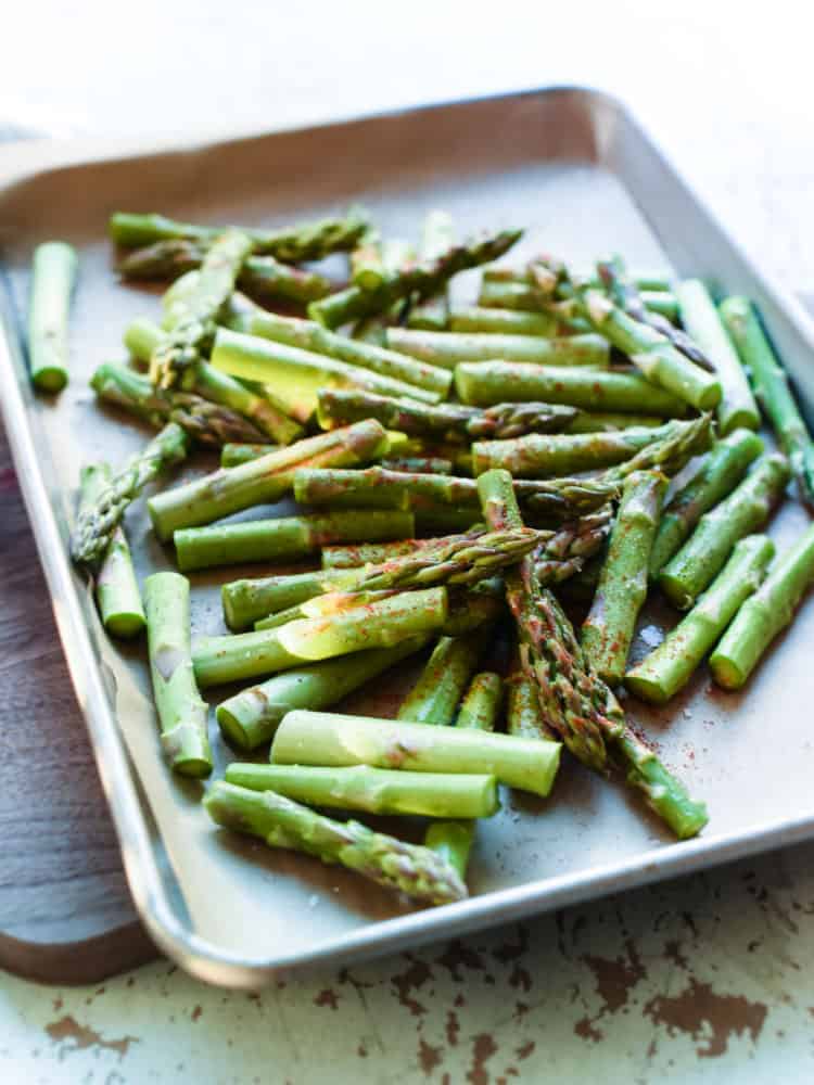 Hot Chili Blistered Asparagus with Sriracha Aioli is simply addictive! They're sure to please a crowd, whether served as an appetizer or a spicy snack