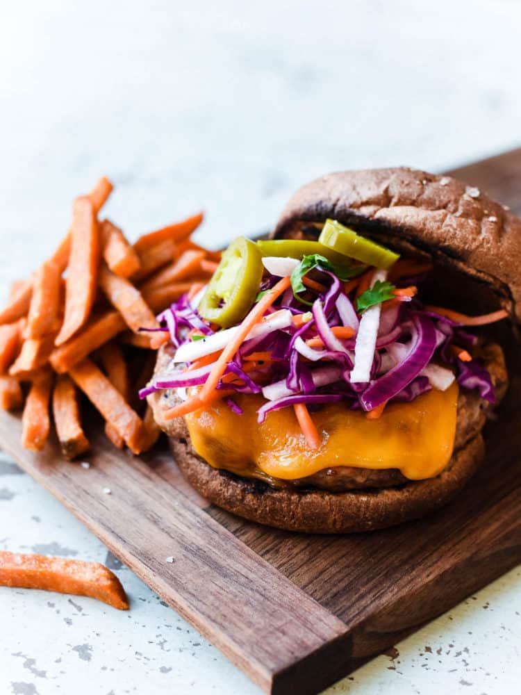 Fire up the grill for Filipino-style Adobo Burgers! They get so much flavor from marinating in soy sauce, vinegar and garlic, classic Filipino adobo flavors.