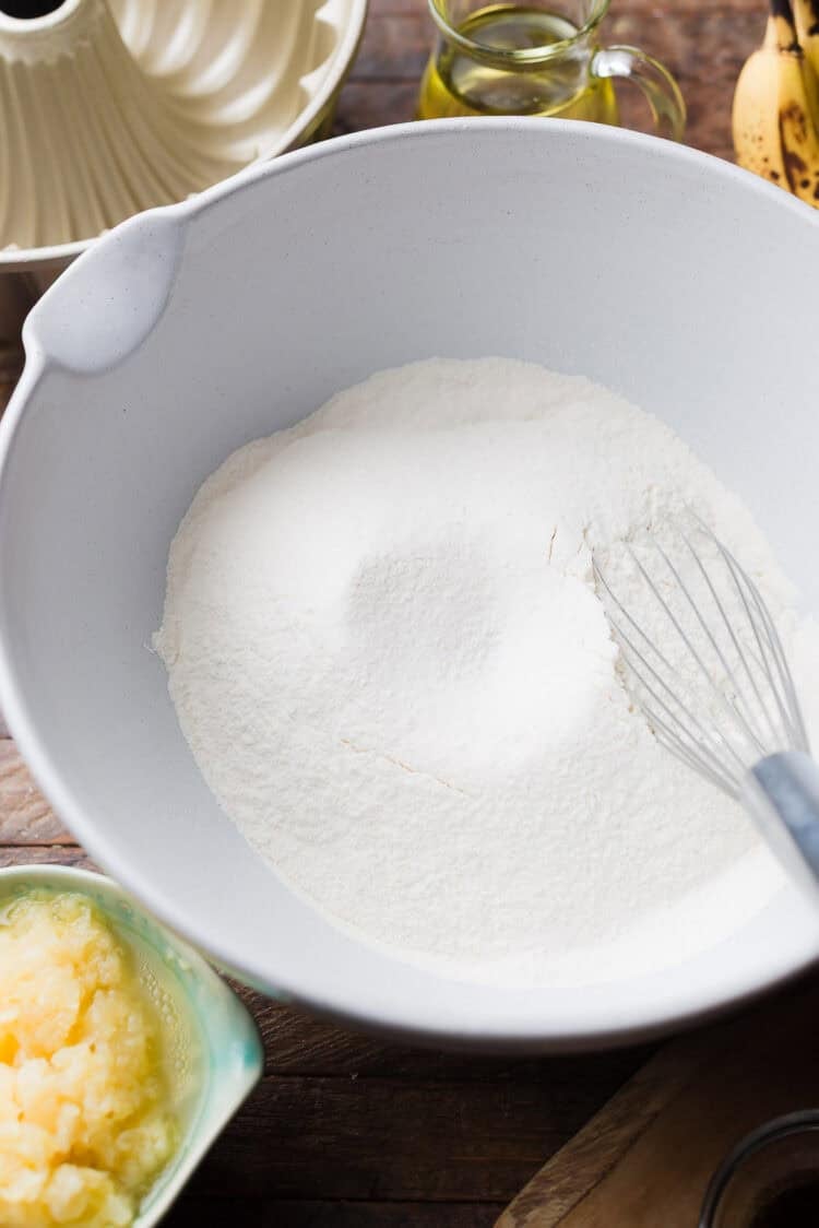 Stirring dry ingredients for Banana Pineapple Cake.